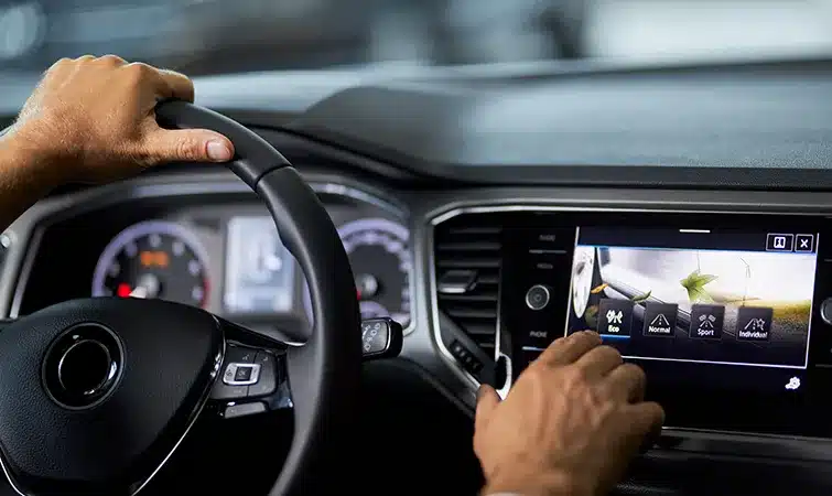 Human operates touchscreen in car
